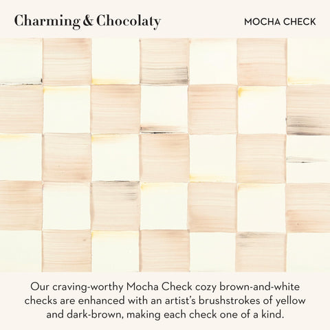 MacKenzie-Childs mocha check vase with flowers enhances a living room vignette