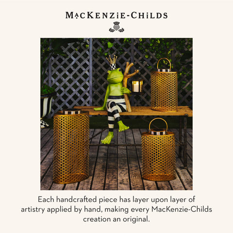 Mackenzie-Childs resin figure with stripe accents adds refined touch