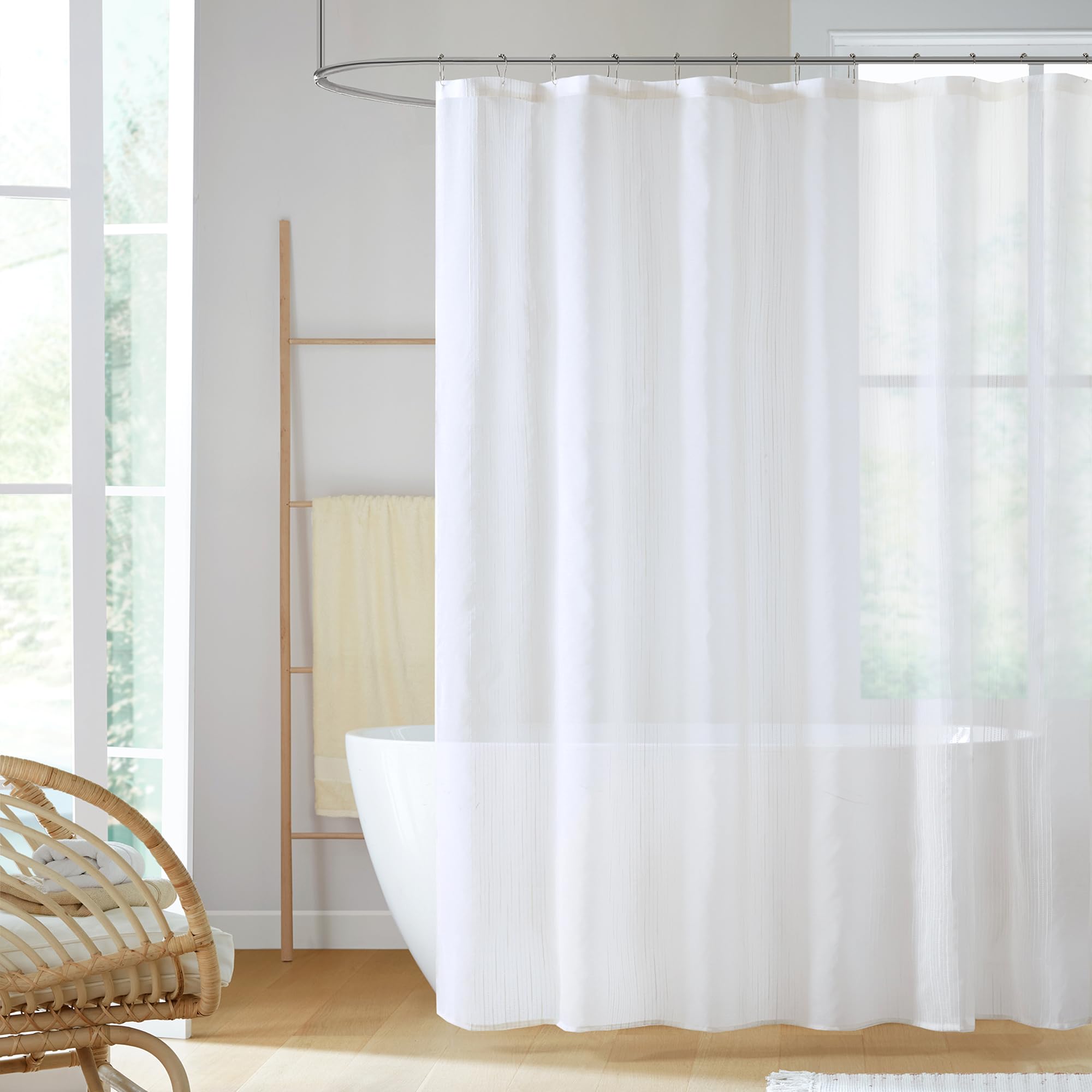Madison Park Anna sheer shower curtain with textured stripes adds depth and airiness.
