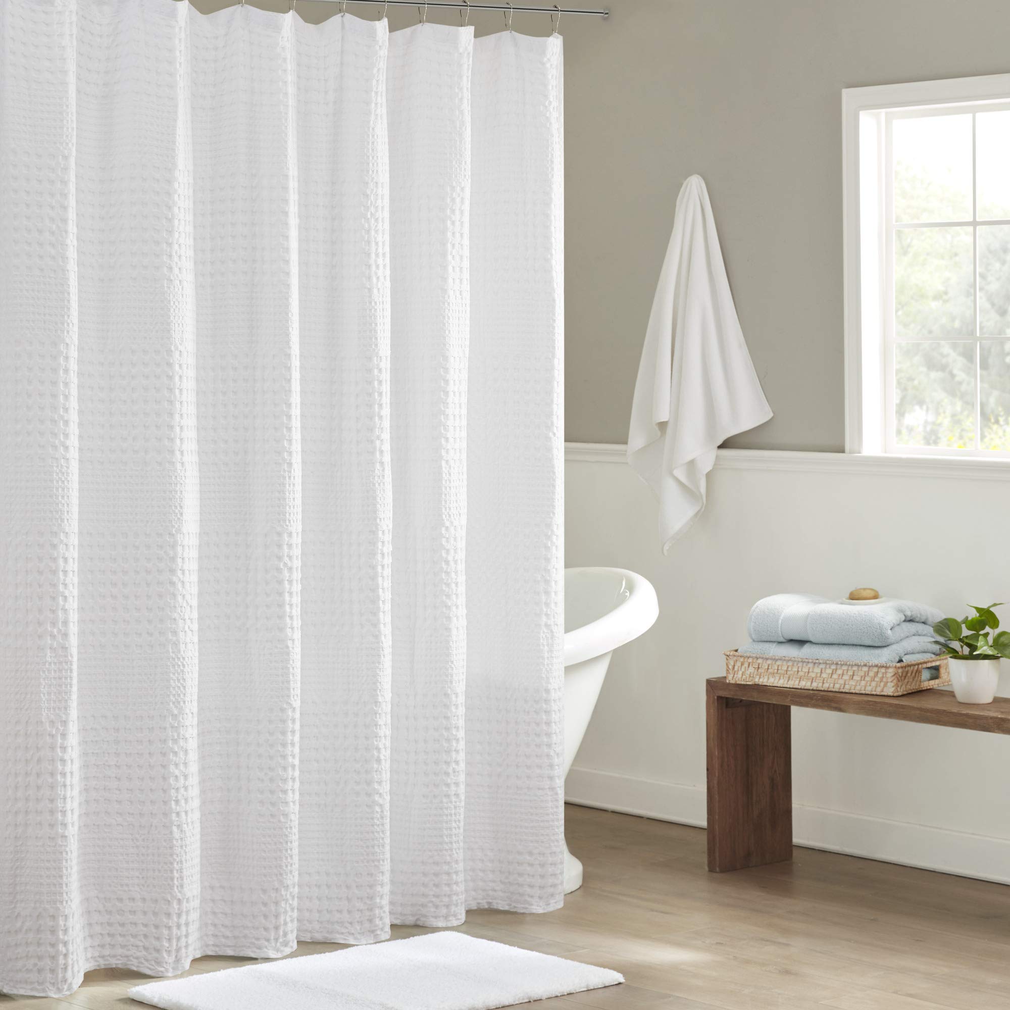 Madison Park Arlo waffle texture shower curtain in white adds spa-like texture.