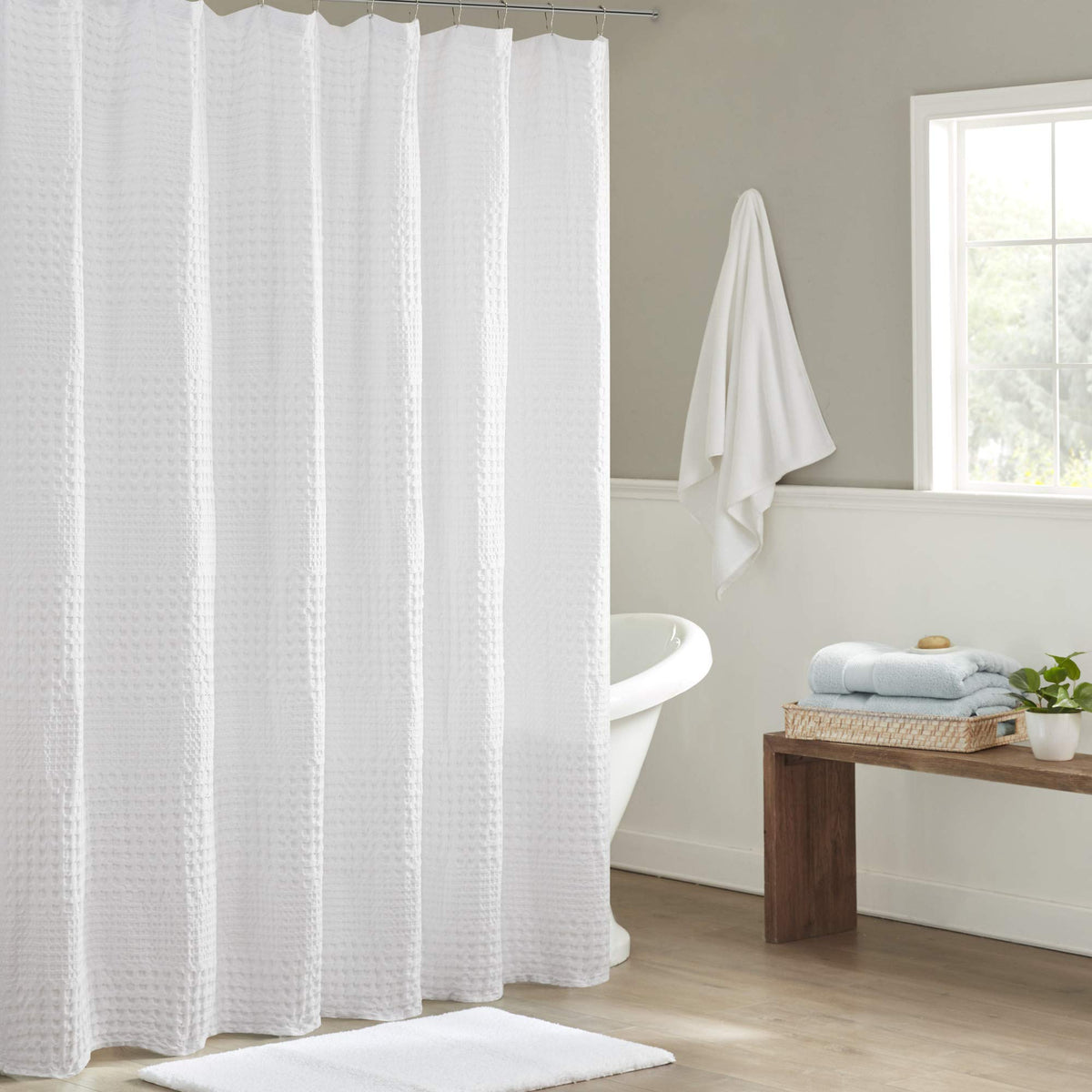 Madison Park Arlo waffle texture shower curtain in white adds spa-like texture.