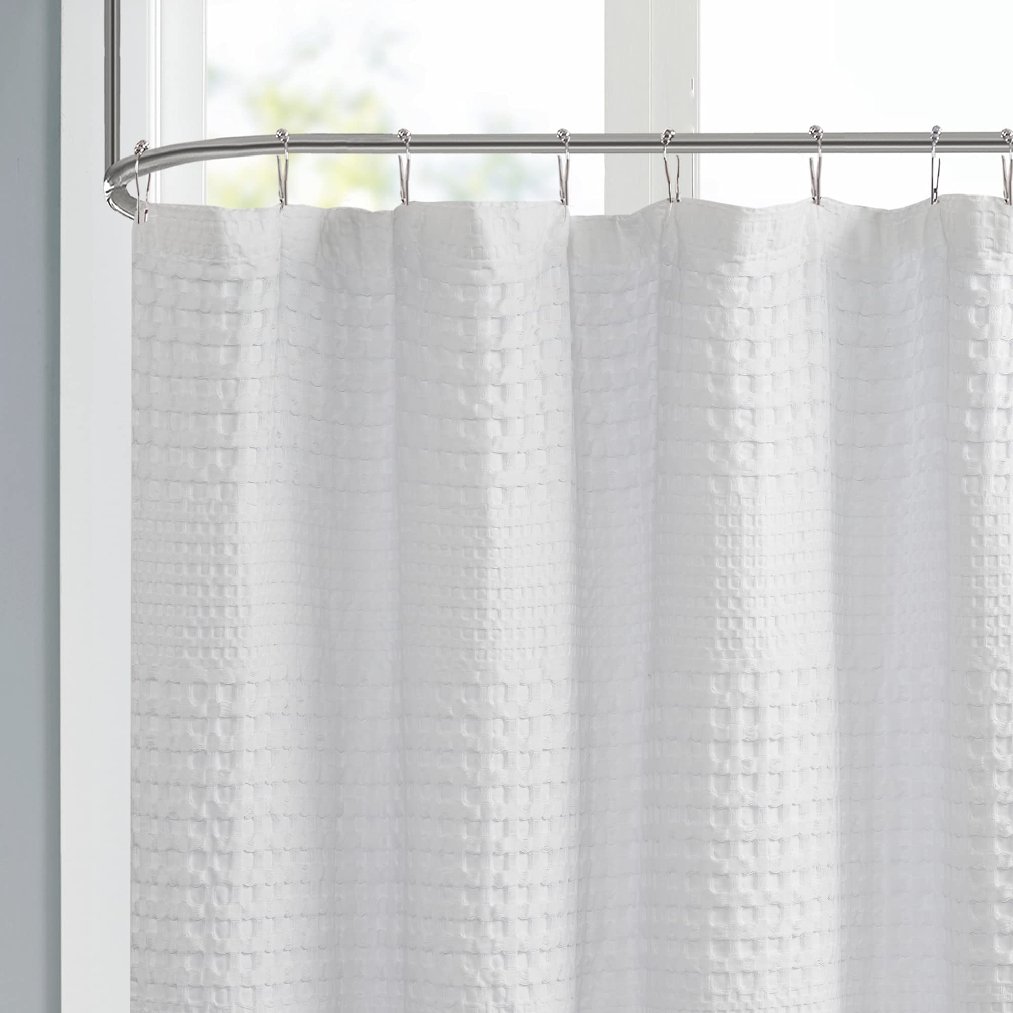 Madison Park Arlo white shower curtain highlights crisp, clean bathroom styling.