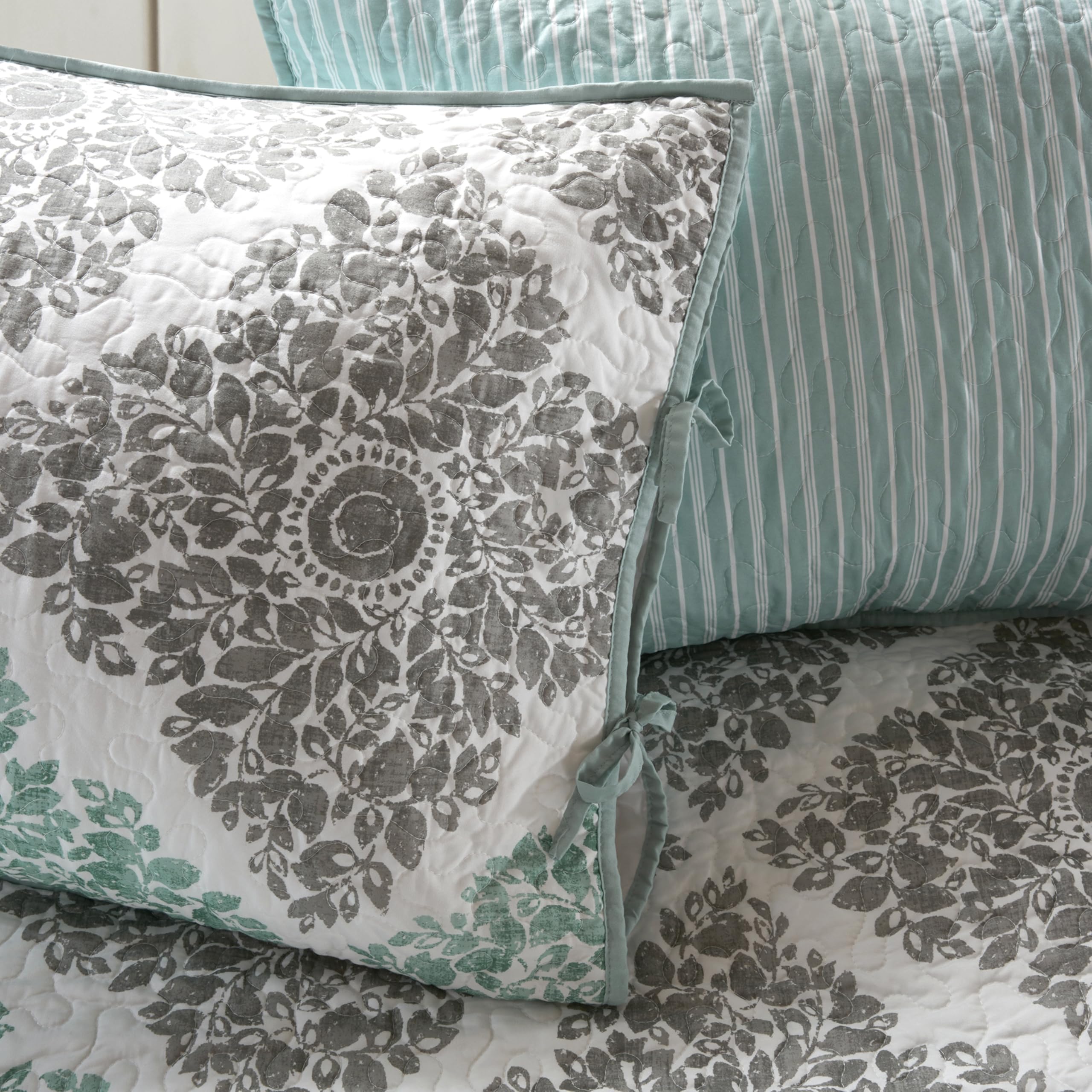Madison Park Decorative Pillow features floral embroidery for texture