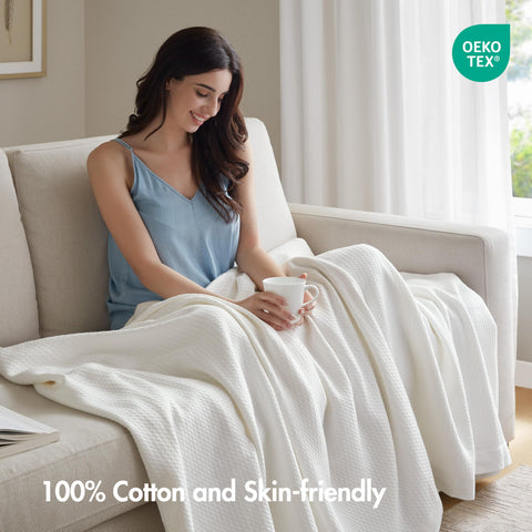 Madison Park Egyptian Cotton Blanket on sofa for versatile living room comfort.