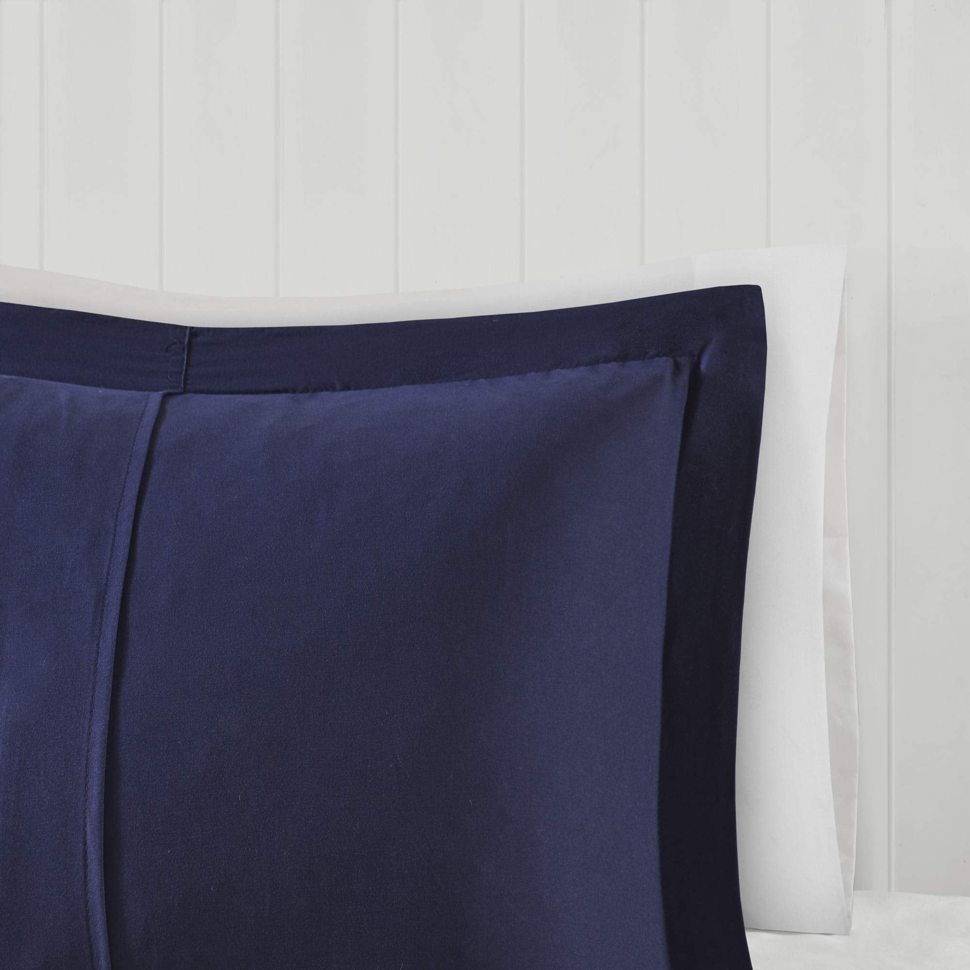 Bedroom setup with Parkston plaid bedding in a calm navy palette