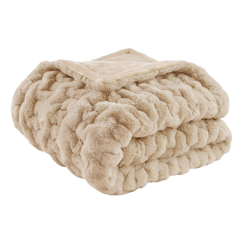 Madison Park Ruched Fur Throw in tan, lifestyle view showing plush warmth for cozy evenings.