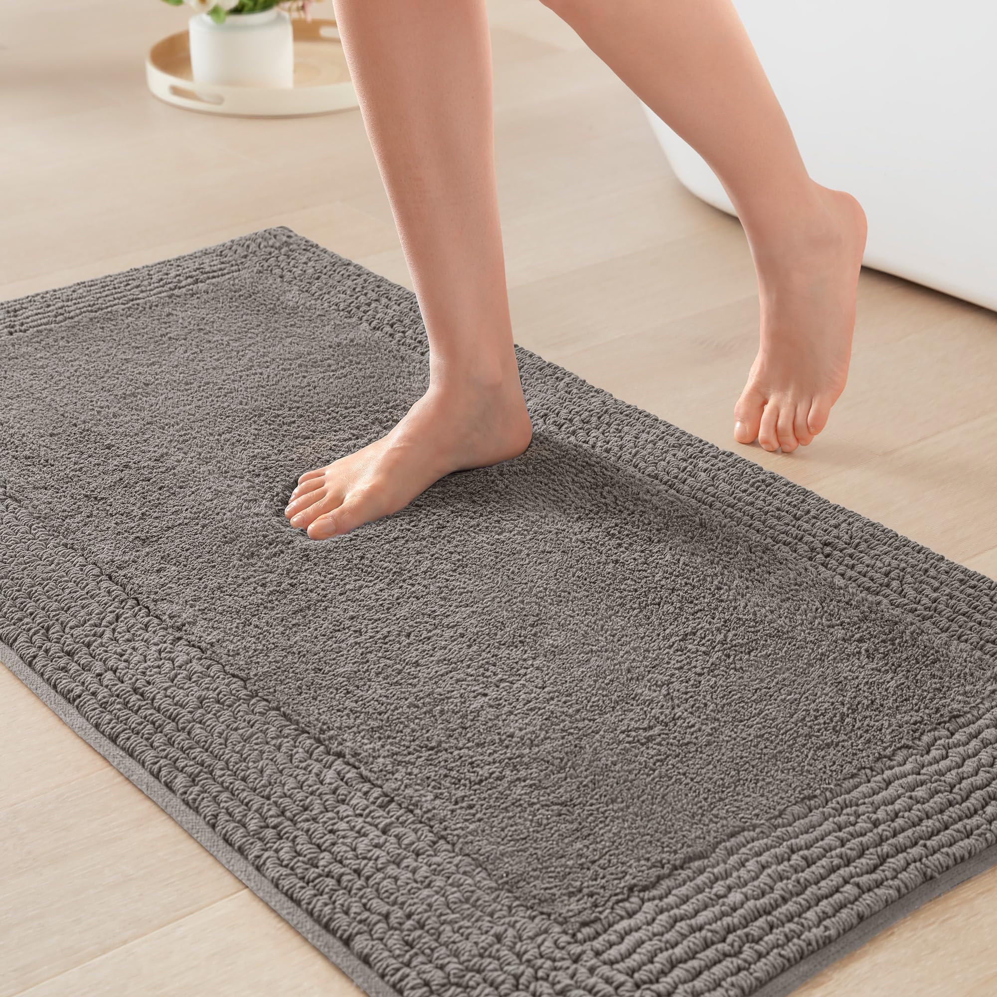 Madison Park Splendor bath rug with dense plush tufted top for luxurious softness.