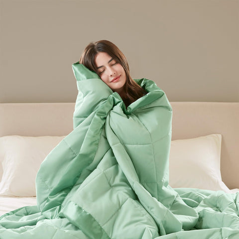 Madison Park Windom all-season layering on bed for warmth.