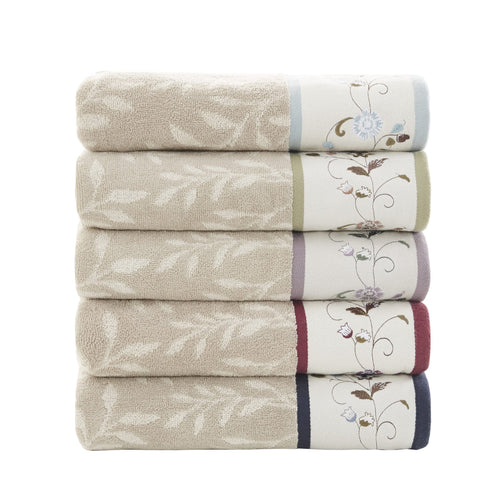 Green piping detail and soft cotton on Madison Park Serene towels for everyday luxury