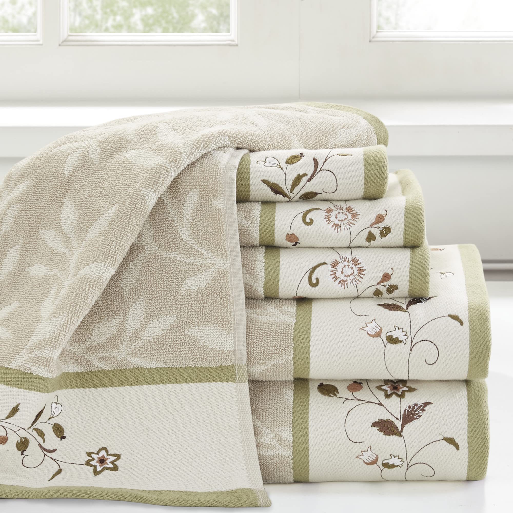 Madison Park Serene hand towels highlight floral embroidery and green piping for refined daily use