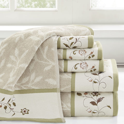 Madison Park Serene hand towels highlight floral embroidery and green piping for refined daily use