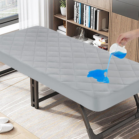 Magik & Kover cot mattress pad waterproof quilted top protects mattress during camping.