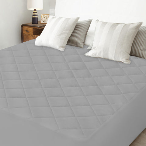 Magik & Kover grey color complements modern bedroom decor