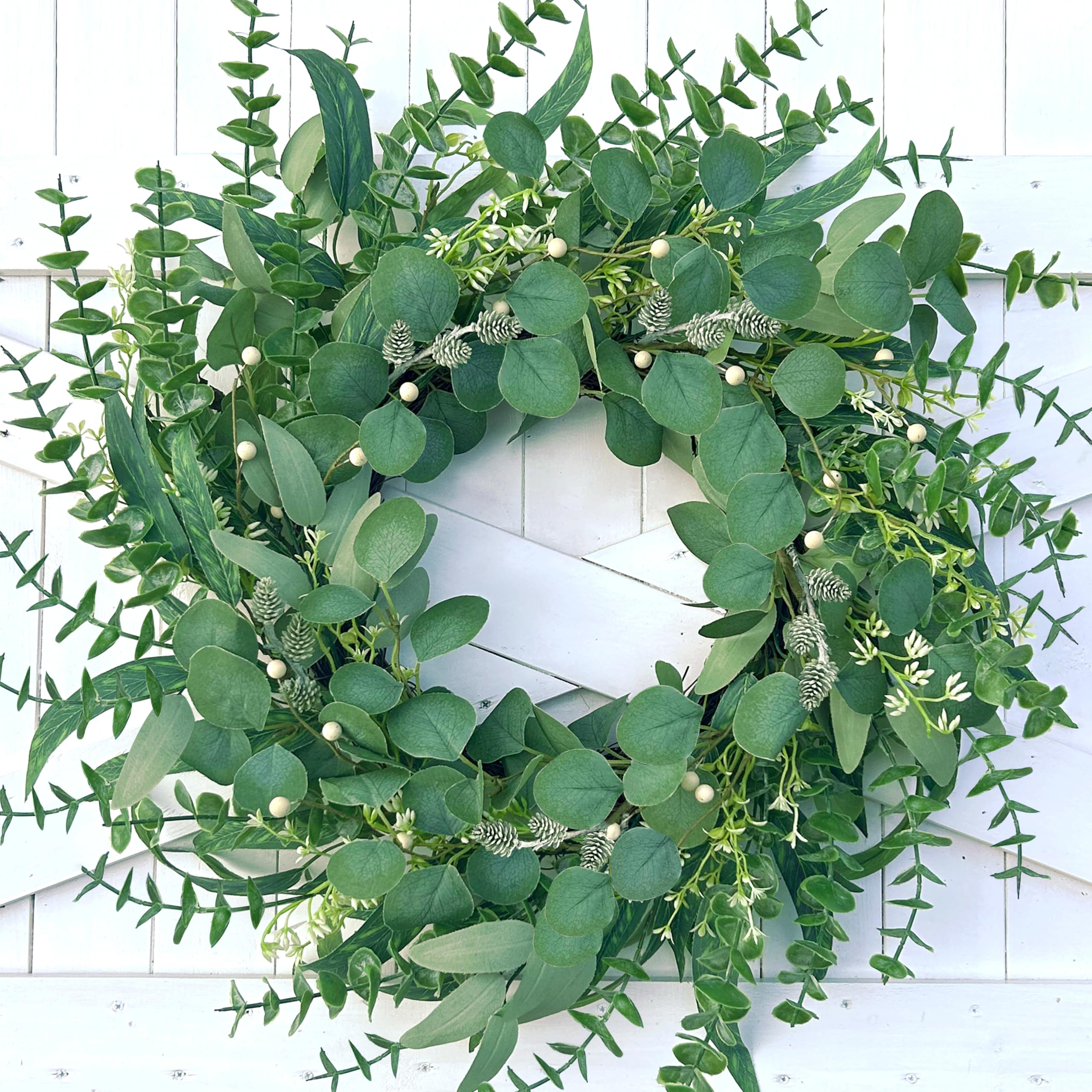 MAINGKAUNG spring wreath close-up shows eucalyptus leaves for lifelike ambiance