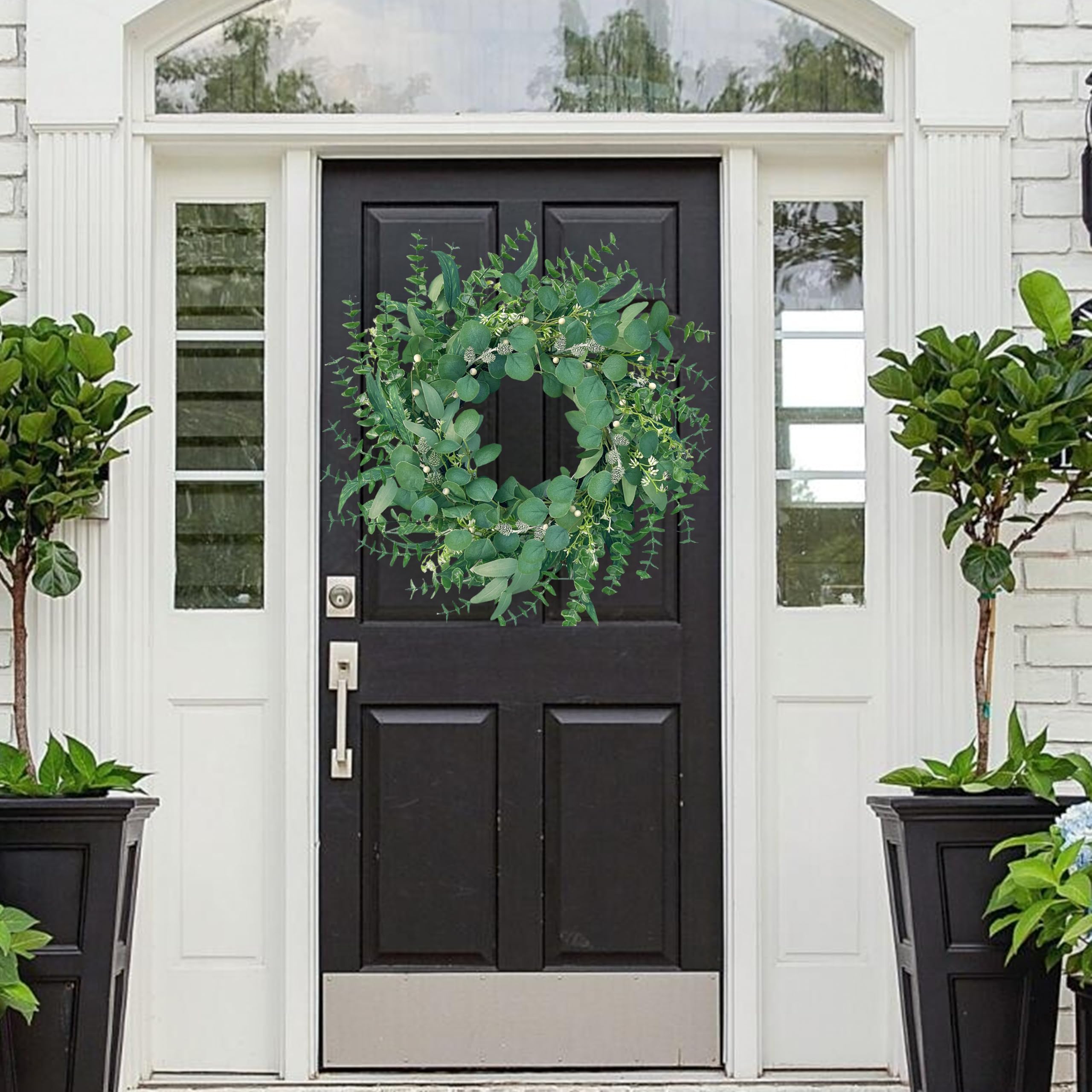 MAINGKAUNG wreath detail features pine cones and texture