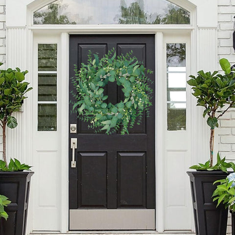 MAINGKAUNG wreath detail features pine cones and texture