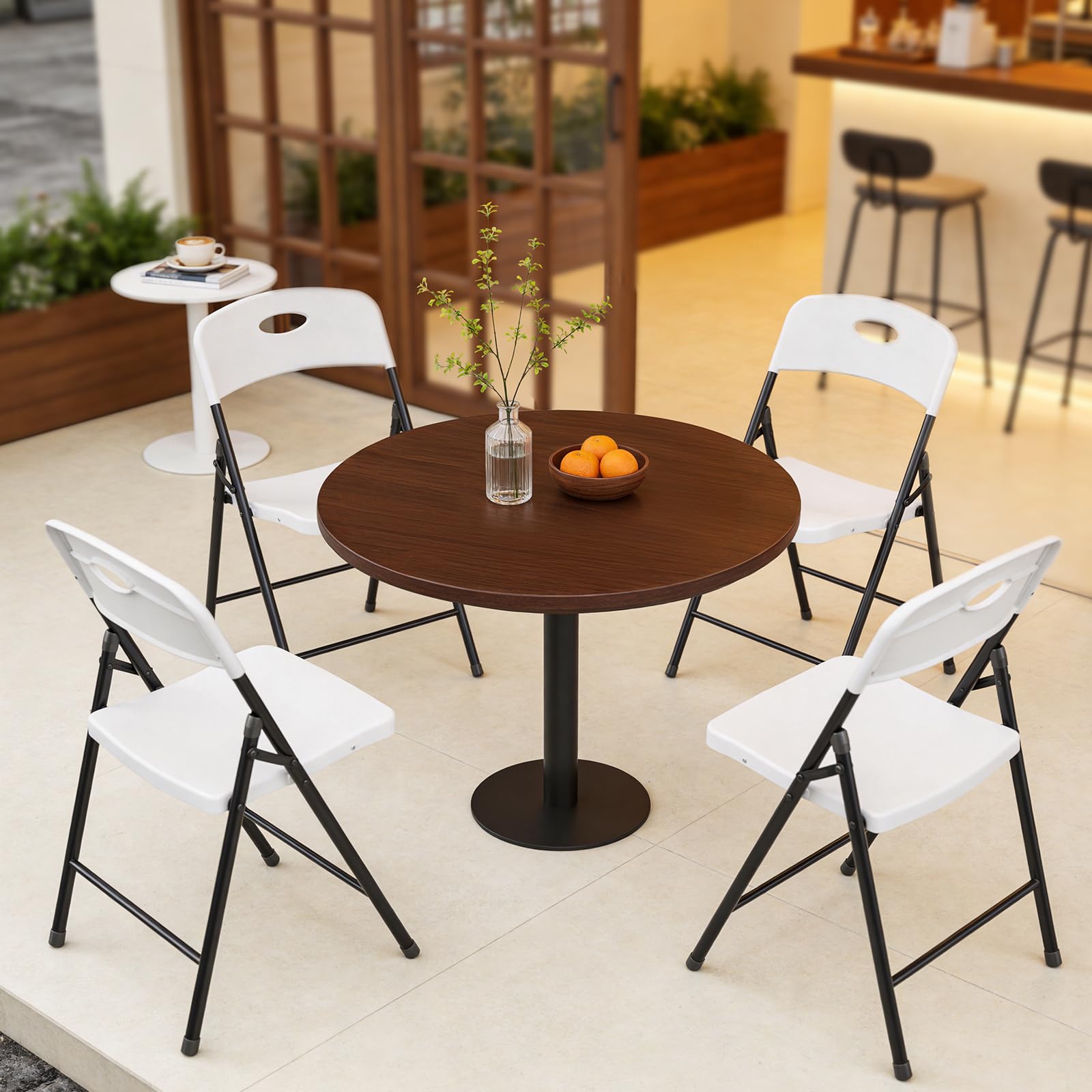 MAKE CHANGES folding chairs at wedding reception with crisp white look.