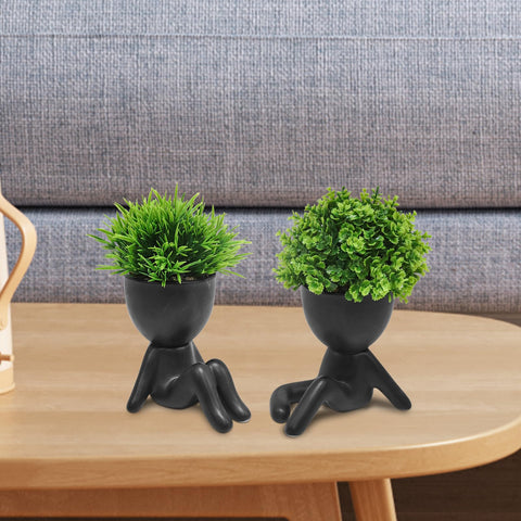 MAKHOT cute artificial plant in human-shaped pot creates a charming bookshelf display