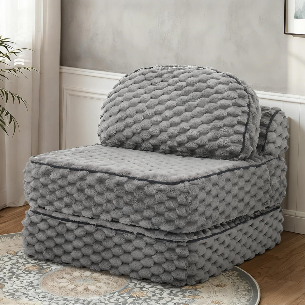 MALOL folding sofa bed in lounge mode offering versatile 3-in-1 comfort for small spaces.