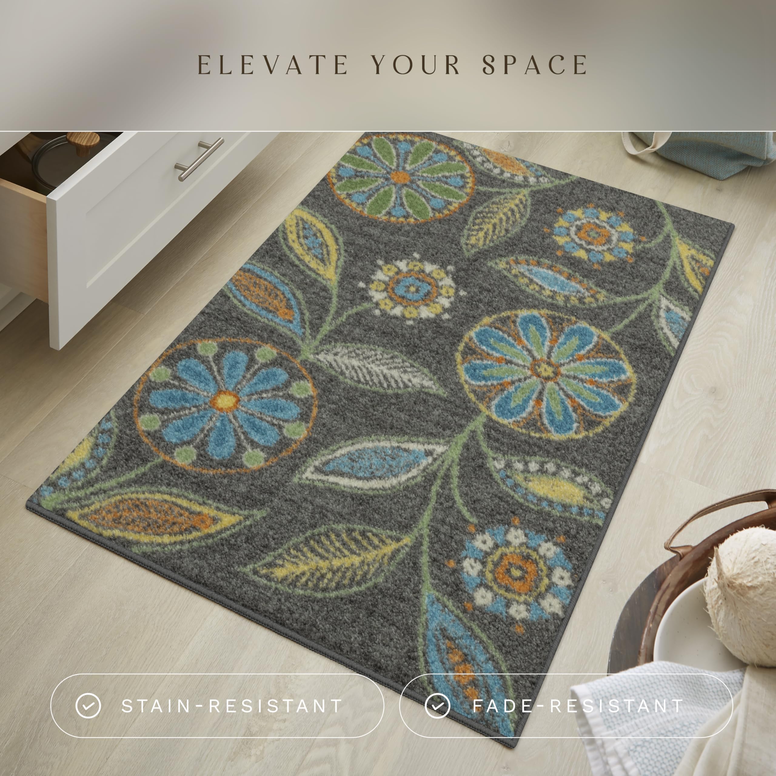 Maples Rugs Reggie floral kitchen rug showing bold colors against dark grey backdrop.