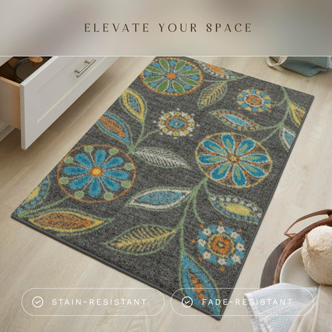 Maples Rugs Reggie floral kitchen rug showing bold colors against dark grey backdrop.