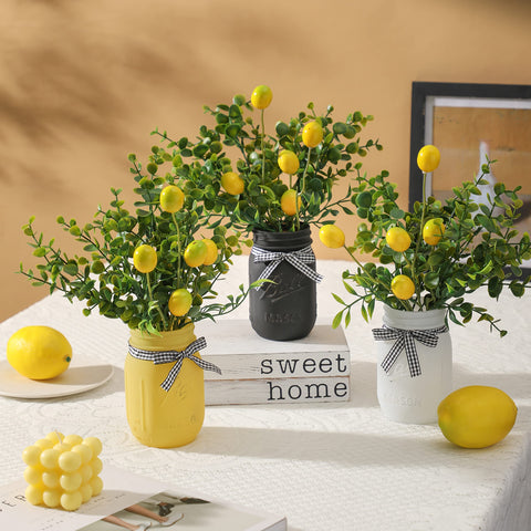 Maracco green leaves sprigs complement the centerpiece for vibrant table decor.