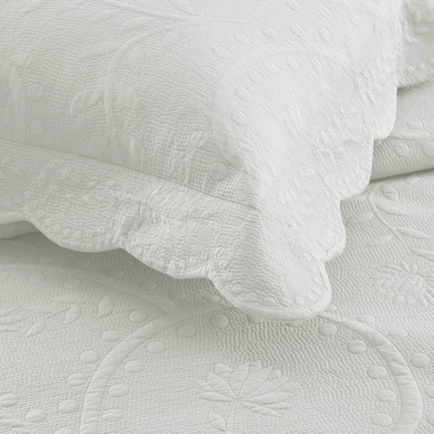 Embroidered farmhouse detail on MarCielo bedding adds artisanal texture and durability.