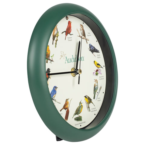 Mark Feldstein Audubon clock, green dial closeup, showcases 12 bird songs hourly.