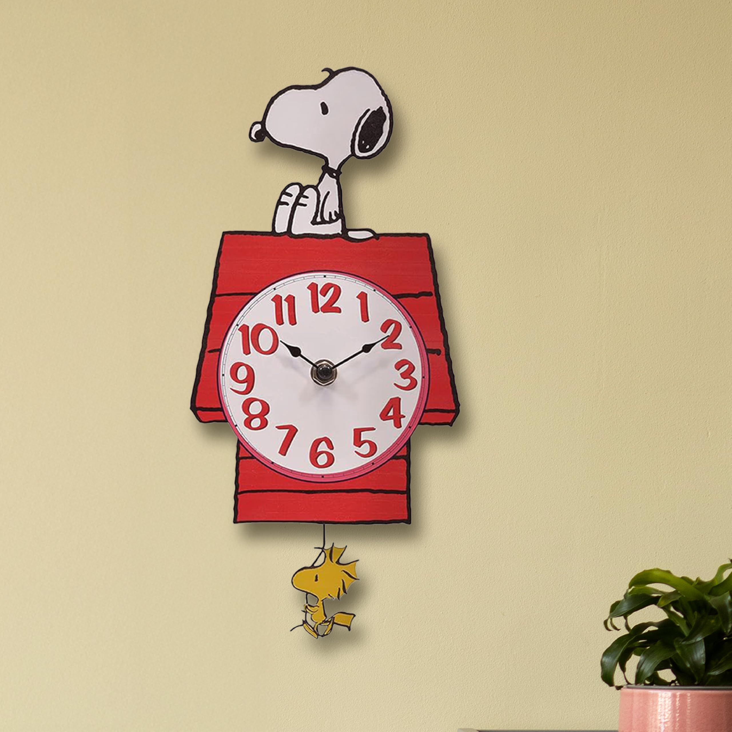 Mark Feldstein Snoopy Doghouse pendulum clock ships safely in protective packaging.