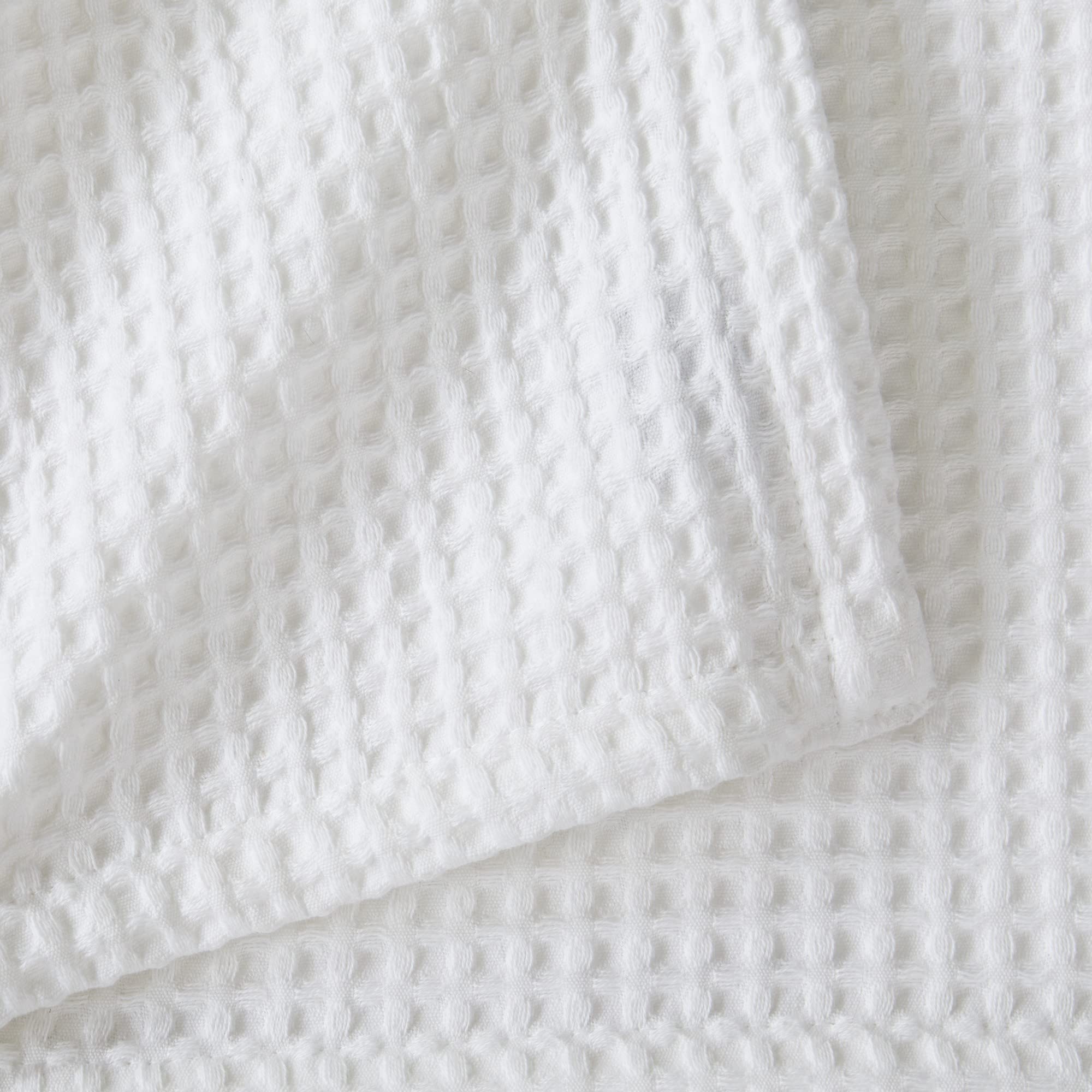 Brielle blanket on a couch illustrating all‑season comfort and style