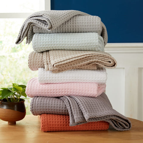 Brielle blanket folded neatly, ready for easy layering on any sofa or bed