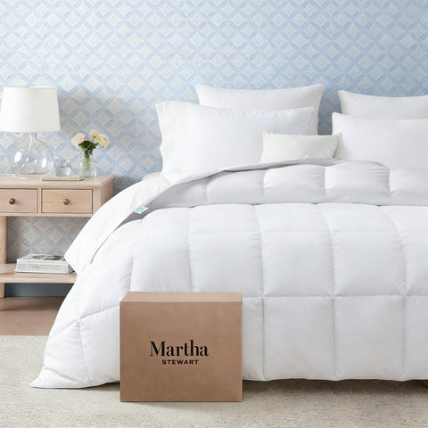 Martha Stewart unpacking and fluffing the duvet insert after vacuum-sealed packaging.