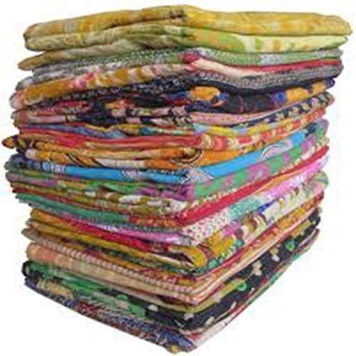 Marubhumi Kantha quilts close-up showing vibrant vintage cotton patches for cozy decor.