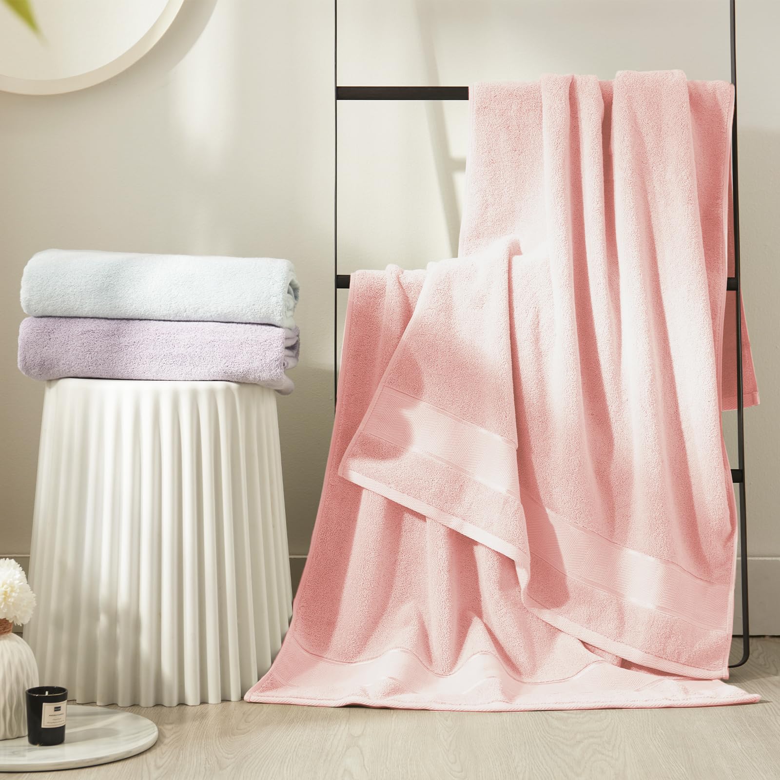 Marvione absorbent soft bath towels in pink displayed on rack.
