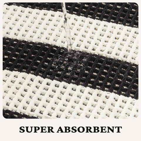 MatEssenz tassels edge bath mat adds boho charm and fringe detail.