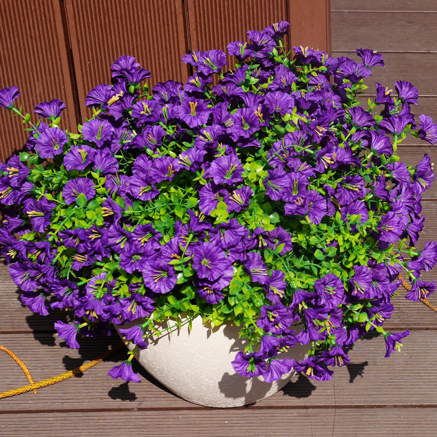 Maxkes front porch garden decor with artificial blooms.