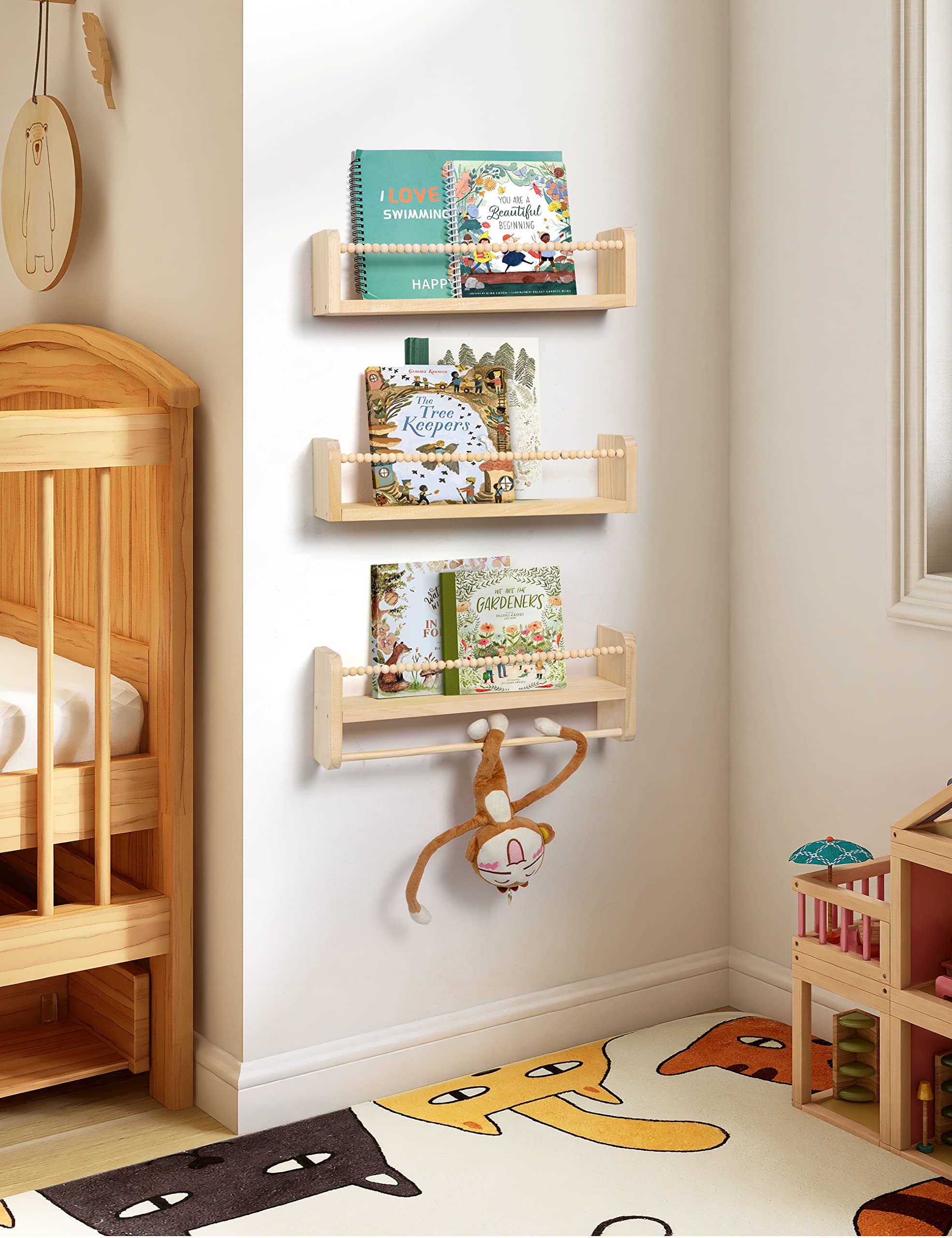 Maxpeuvon wall-mounted bookshelves with protective bar safeguard kid toys and small books.