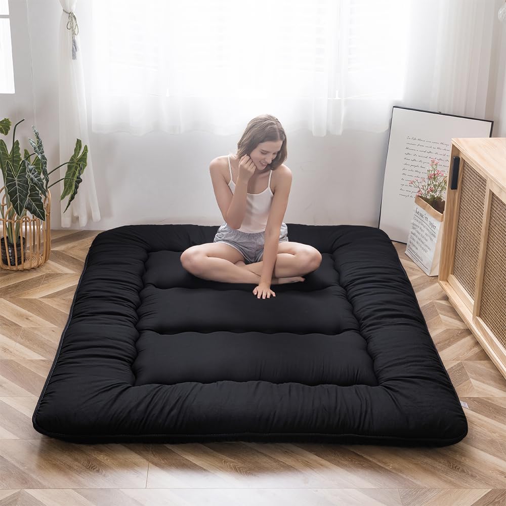 MAXYOYO Japanese floor mattress folded for storage and quick setup.