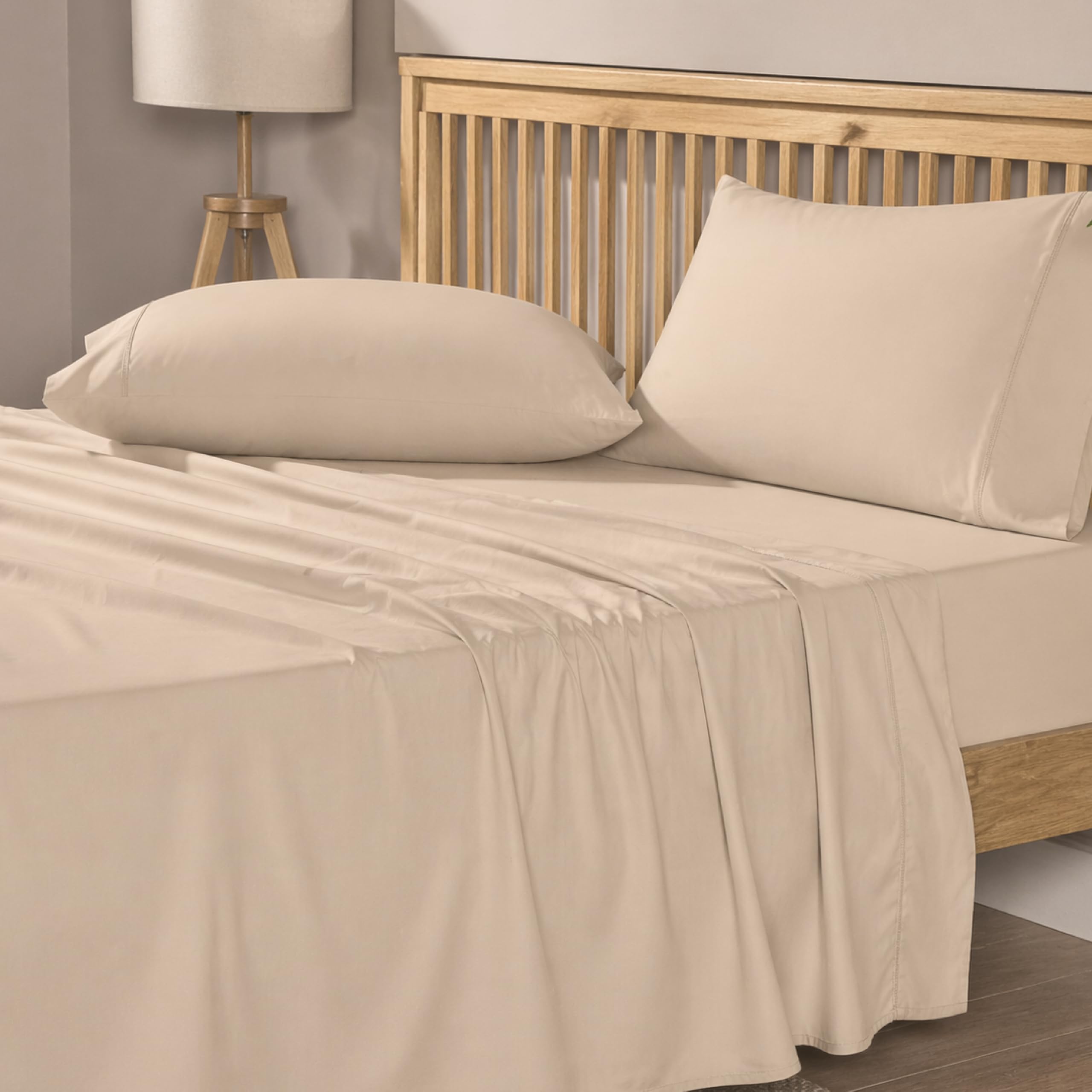 Mayil Manor cream beige 4-piece set on a bed for hotel-inspired comfort