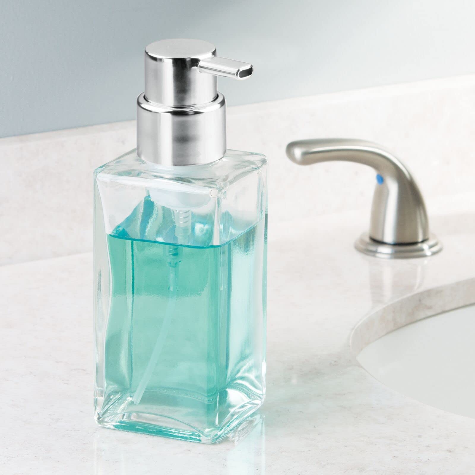 mdesign glass dispenser on vanity keeps foaming soap within easy reach