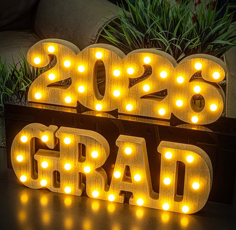 Meadin Grad 2026 LED letters glow as a table centerpiece for graduation parties