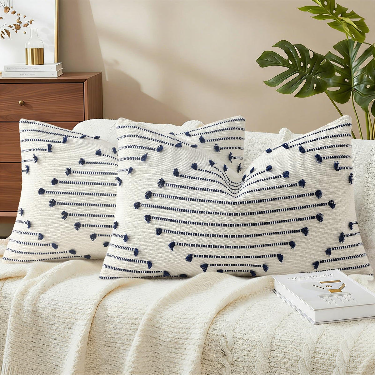 Mecatny boho outdoor pillow cover with navy tassels on cream background for patio decor