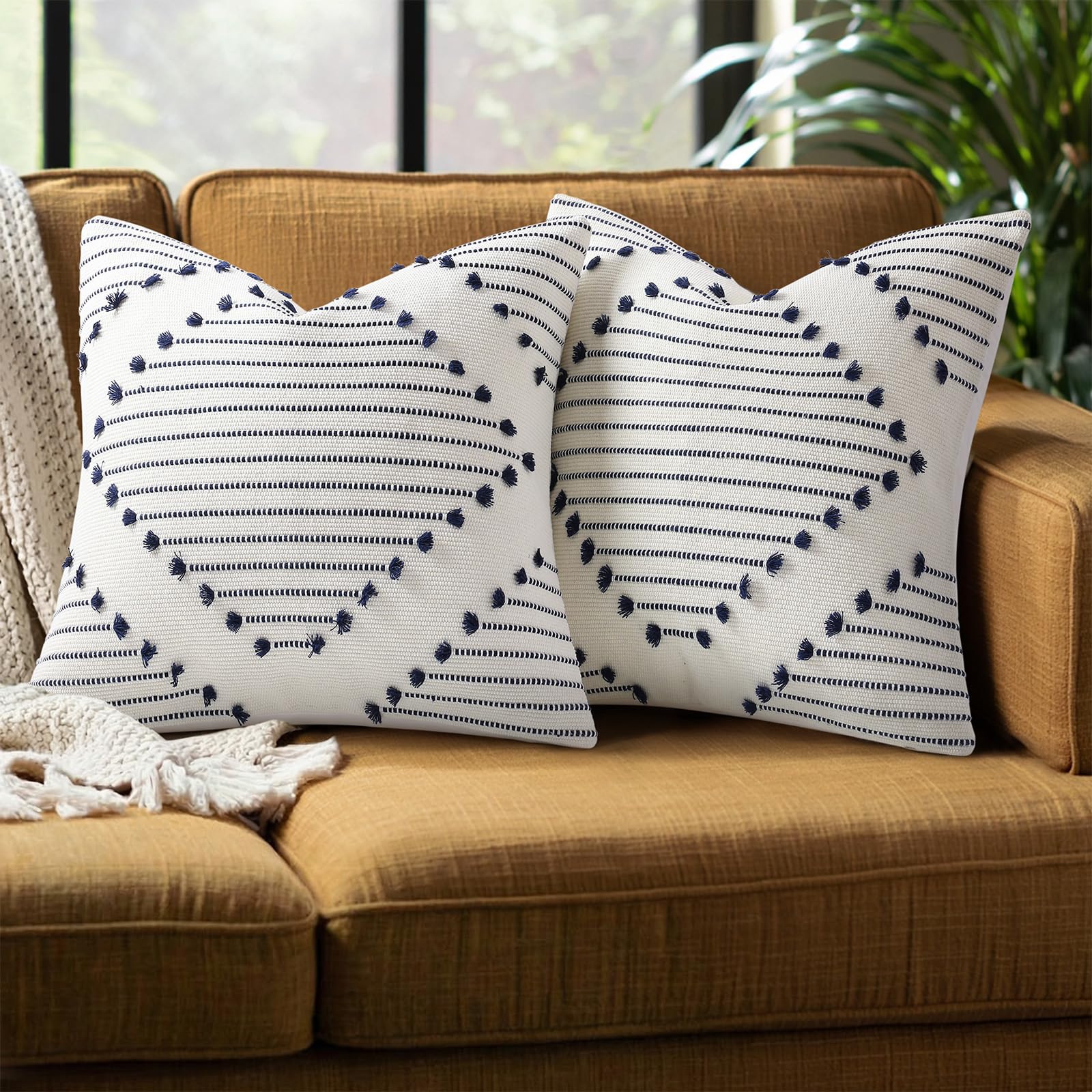 Mecatny boho outdoor pillow cover in navy and cream enhances living room decor