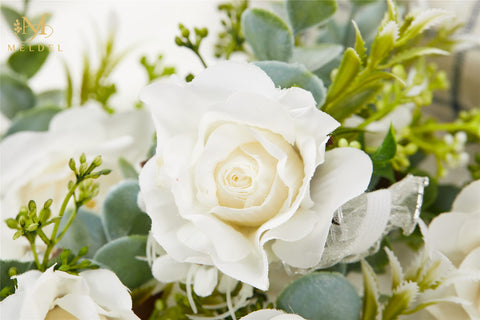 Meldel greenery and eucalyptus accents wrist corsage closeup showing natural elegance
