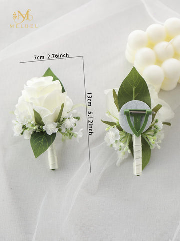 Meldel wedding boutonniere for groomsmen elevates attire with timeless white blooms.