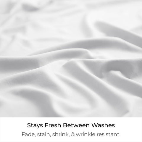 A bedroom scene showcasing Mellanni bed skirt integrated with rest of luxury bedding