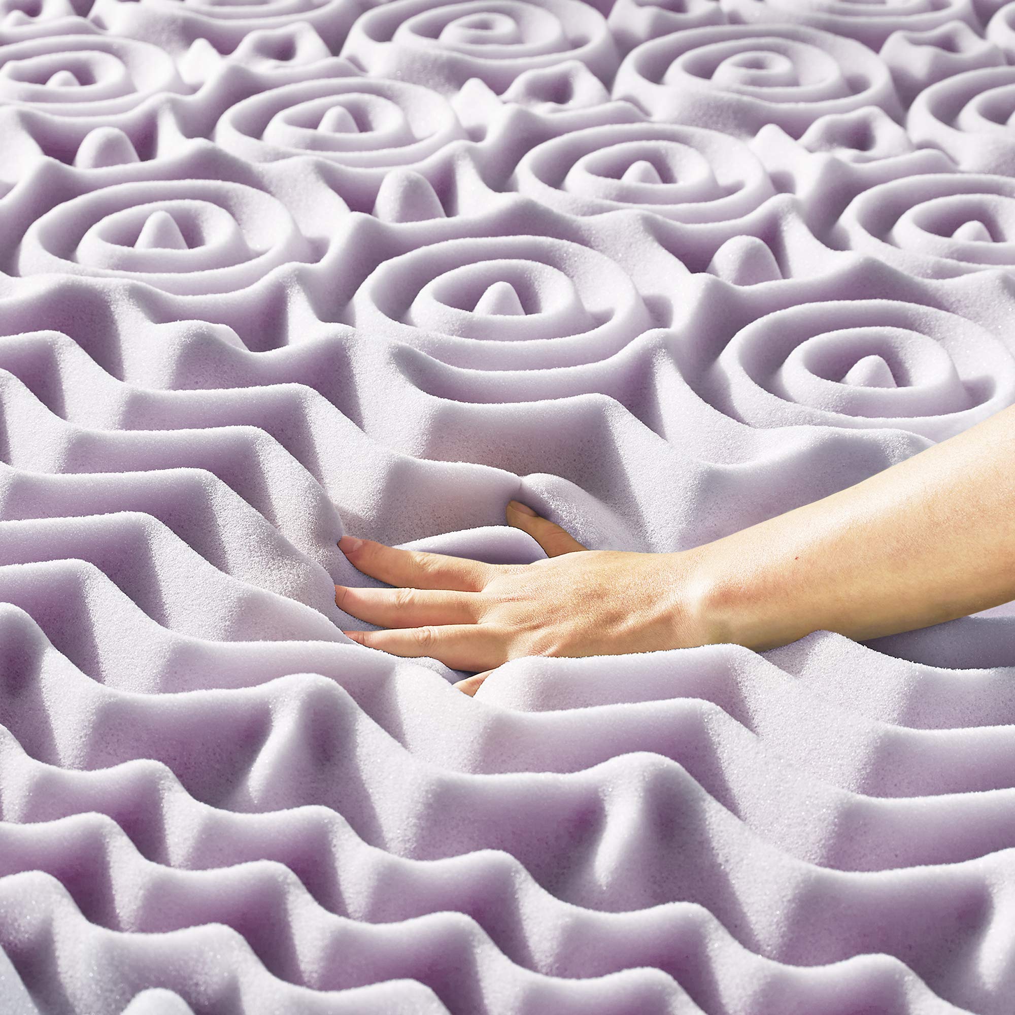Mellow queen dorm essentials topper shown on a bed for versatile comfort.