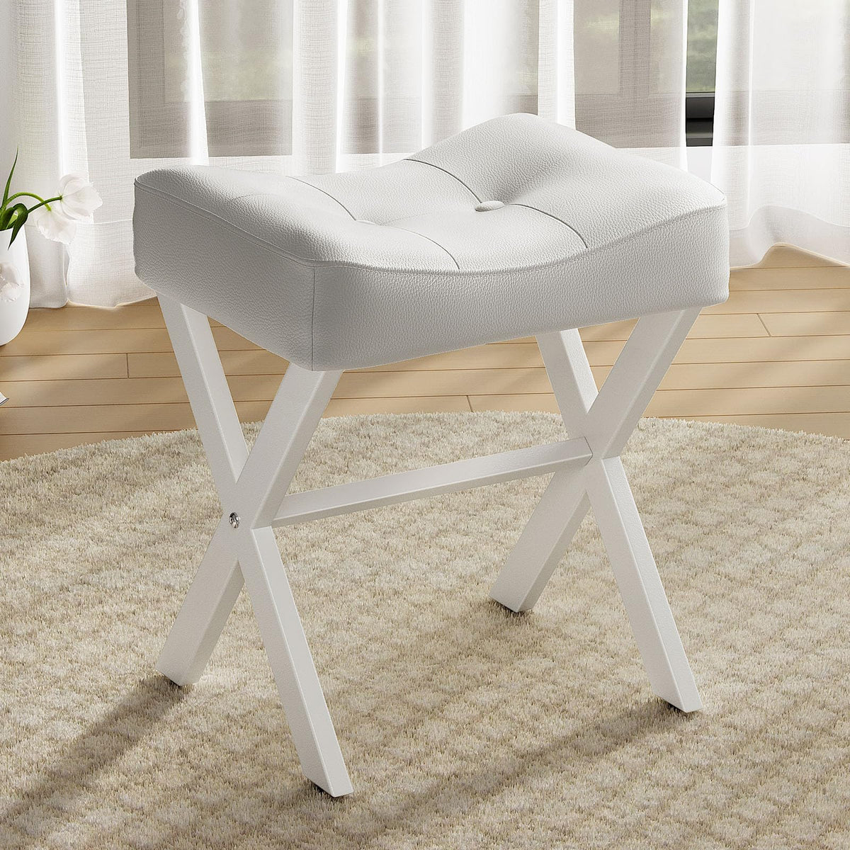 Memobarco 18-Inch Leather Vanity Stool with white saddle seat and metal X-legs offers ergonomic seating.