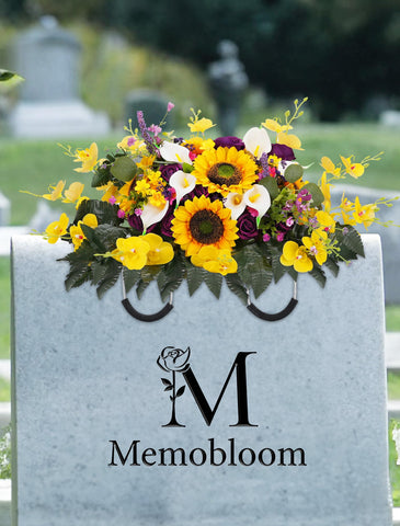 Memobloom cemetery flowers on headstone with adjustable arms for secure placement.