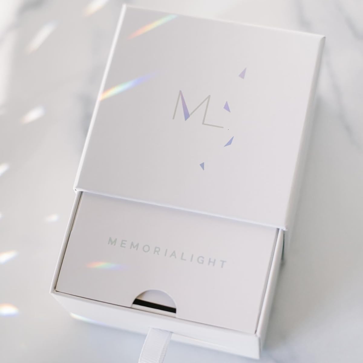 Memorialight color-splashed rainbow beam creates everyday remembrance in living spaces.